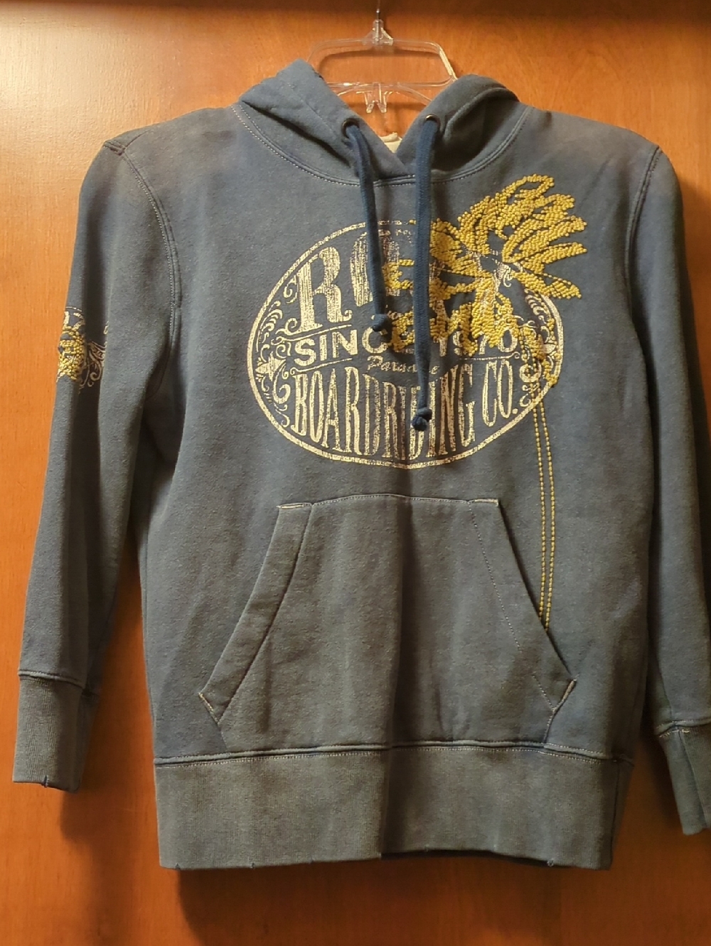 Roxy Navy Blue Pullover Hoodie with Yellow Palm Graphic